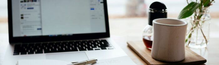 Coffee mug with laptop